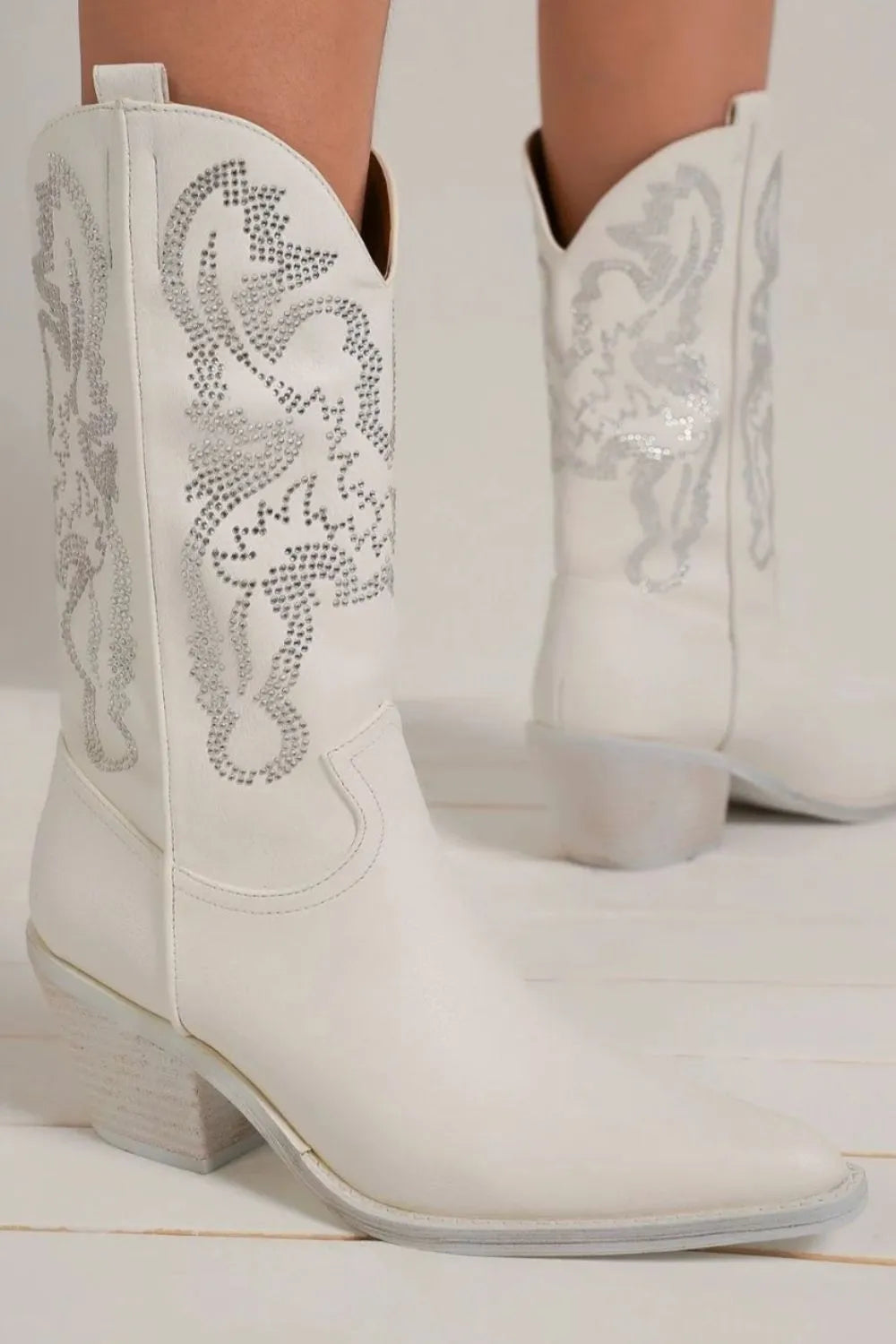 Side view of camel rhinestone western boots heel