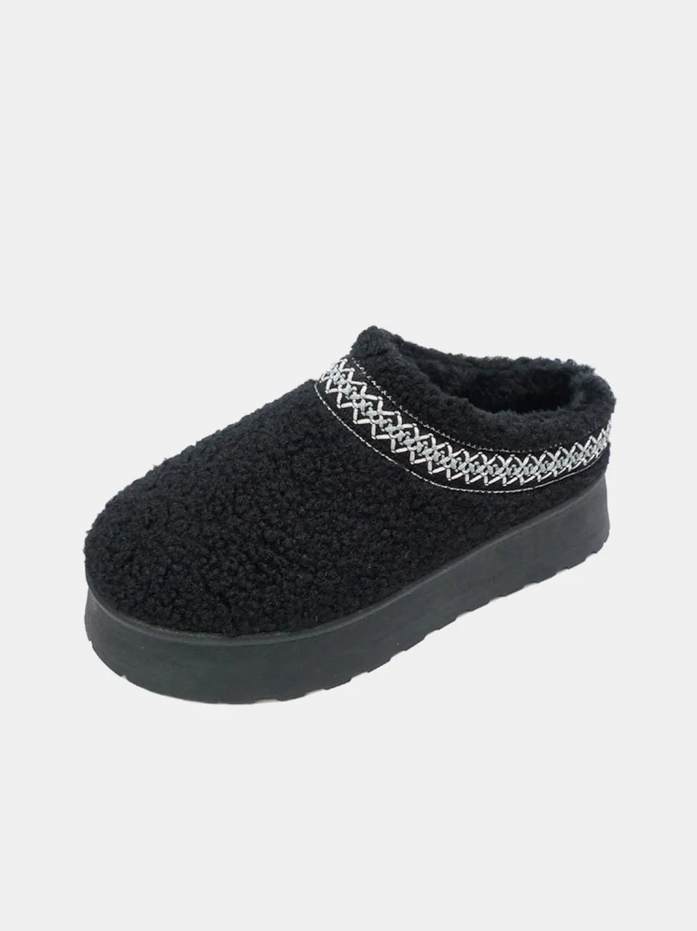 Side view of taupe embroidered sherpa boots with platform sole